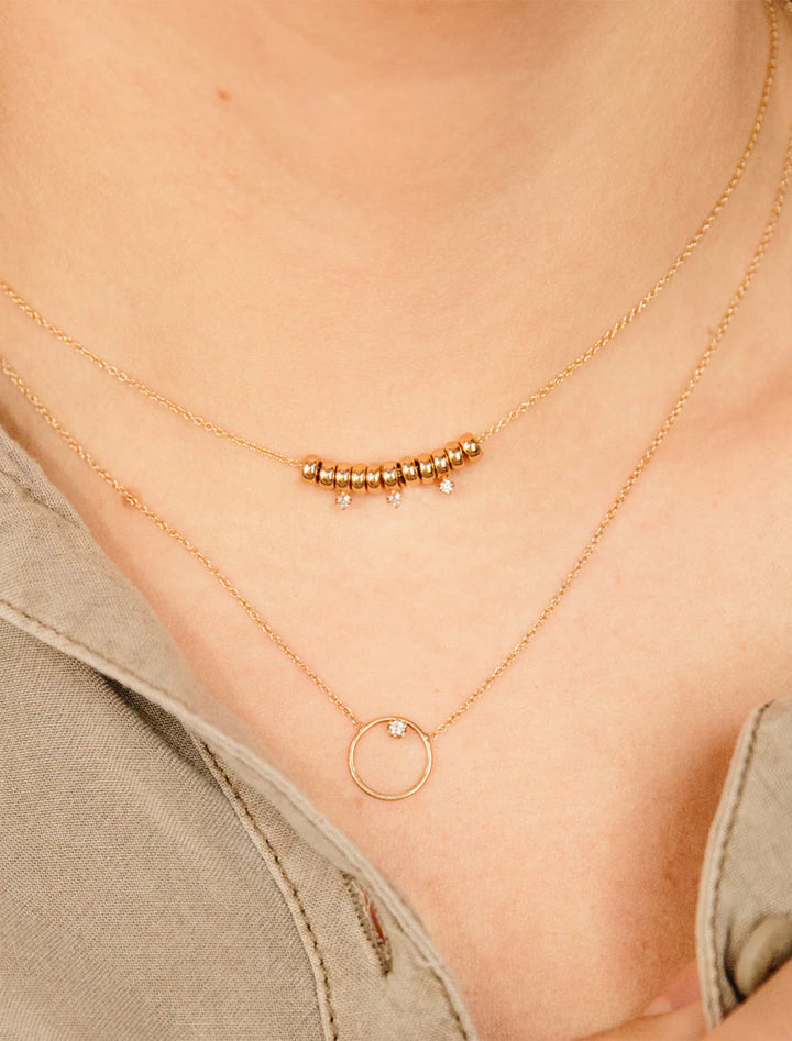 model wearing 14k circle and diamond necklace | 16-17-18" length