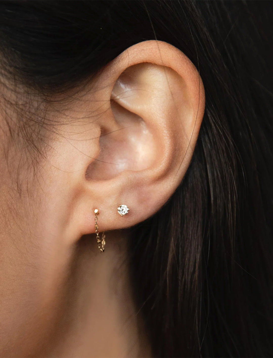 model wearing 14k tiny cable and bead chain earrings