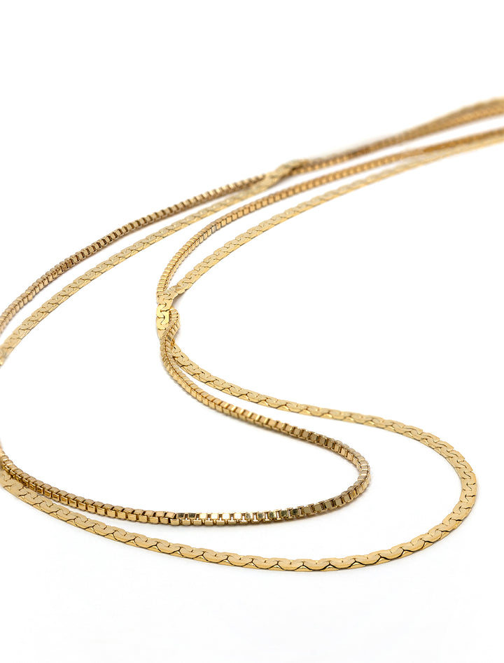 Stylized laydown of AV Max's Double Dainty Disco Necklace.