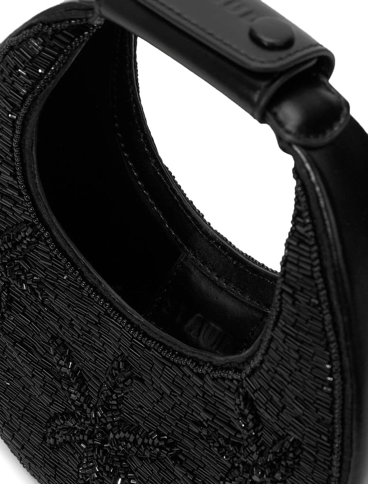 Close-up view of STAUD's good night moon bag in black starfish.