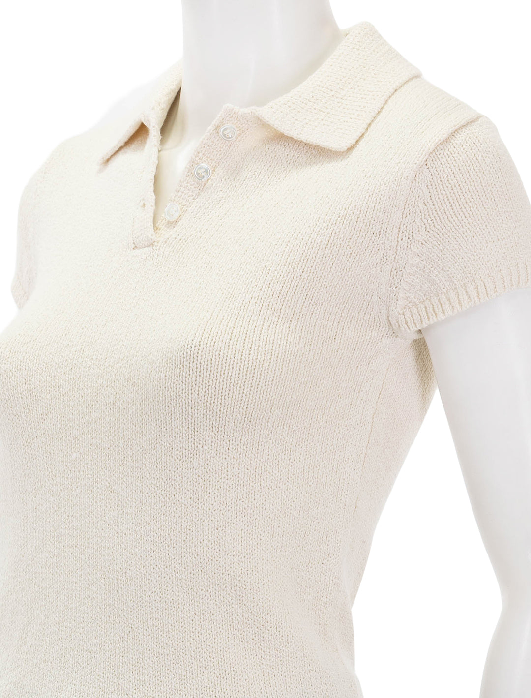 Close-up view of Theory's cap sleeve polo in off white.