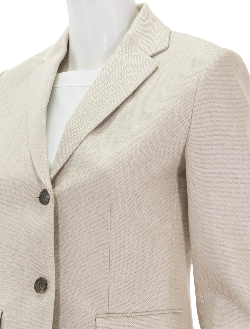 Close-up view of Theory's slim blazer in straw basketweave linen.