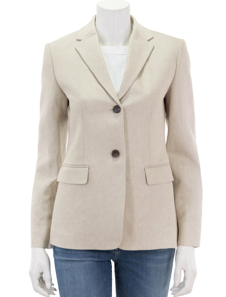 Front view of Theory's slim blazer in straw basketweave linen, buttoned.