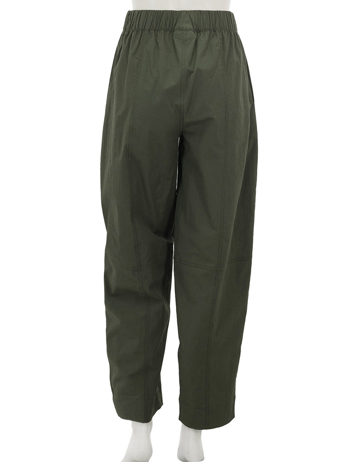Back view of GANNI's curve pant in kombu green.