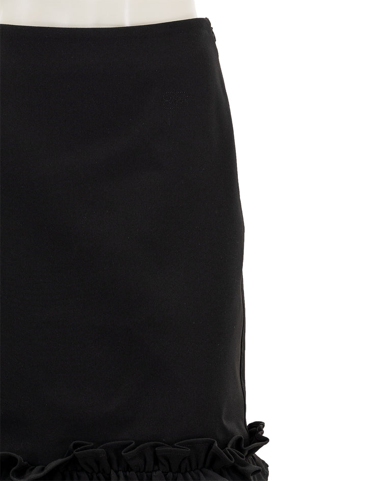 Close-up view of GANNI's bonded crepe skirt in black.