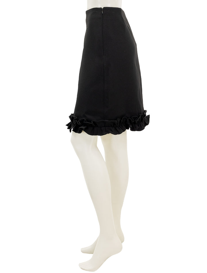 Side view of GANNI's bonded crepe skirt in black.