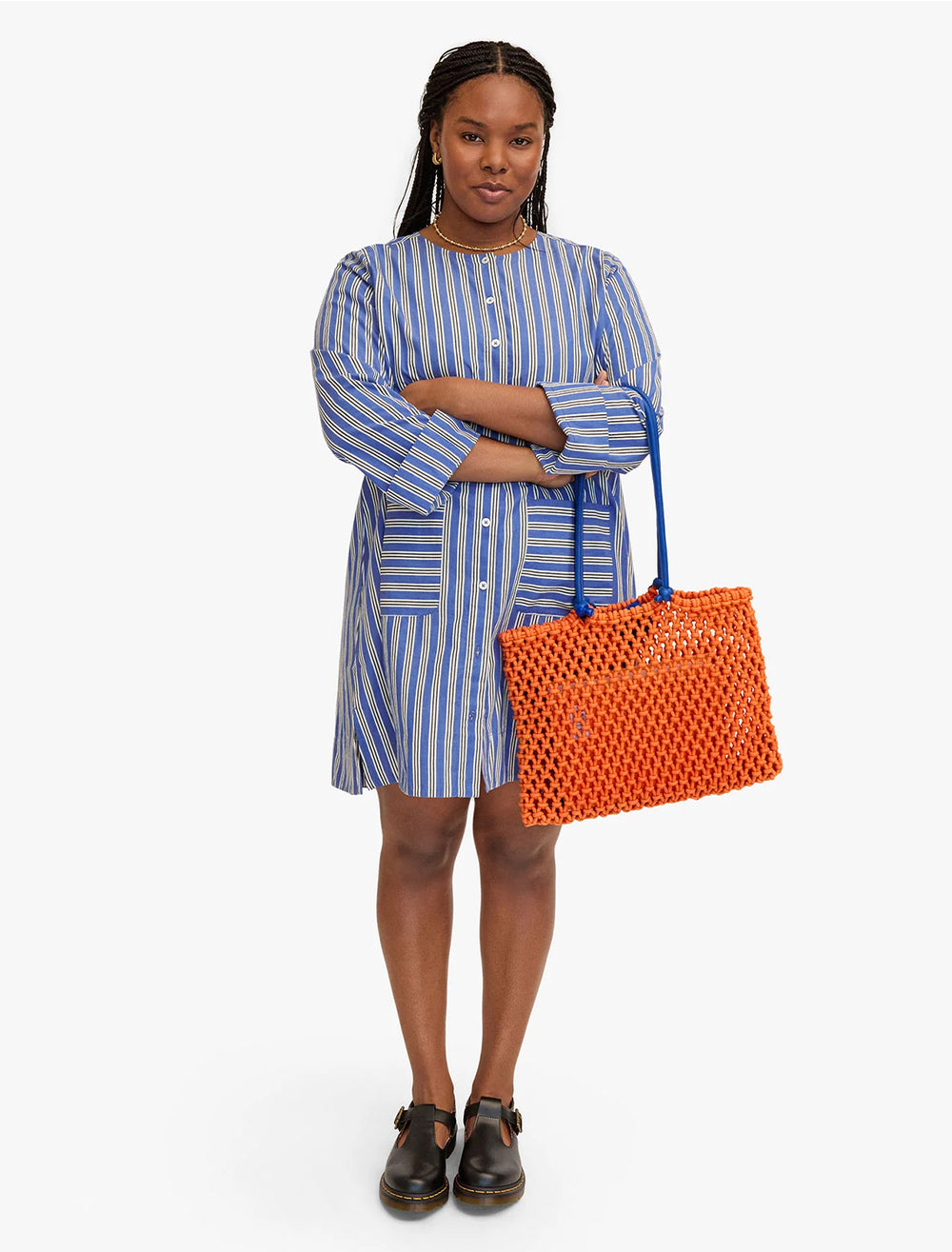 model holding sandy tote in zucca and cobalt