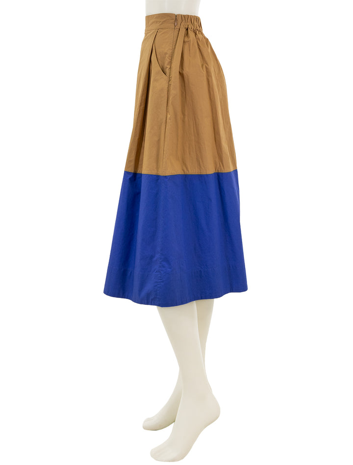 Side view of Clare V.'s genevieve skirt in khaki and cobalt.