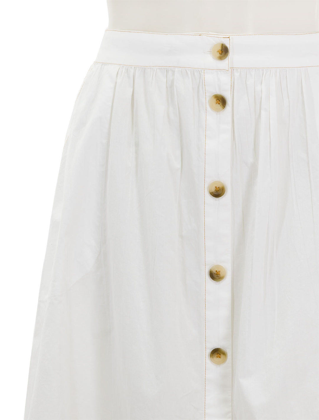 Close-up view of Lilla P.'s button front long skirt in white.
