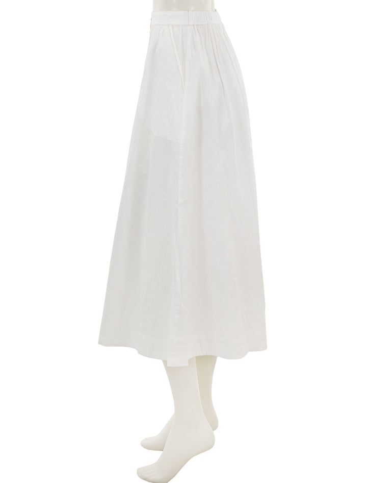 Side view of Lilla P.'s button front long skirt in white.