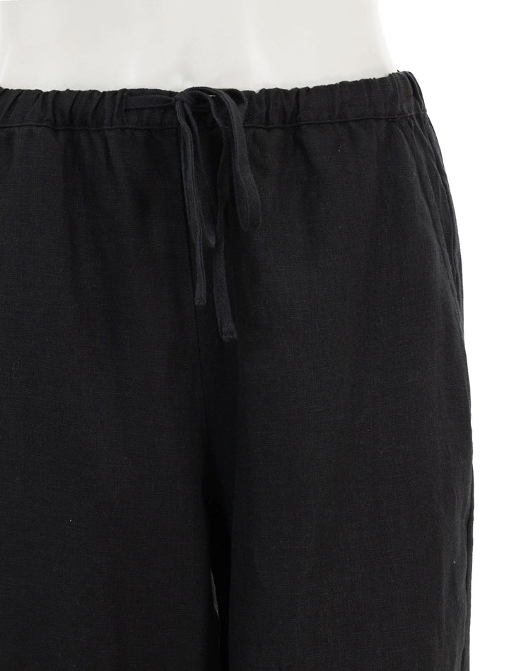 Close-up view of Rails' emmie linen pants in black.