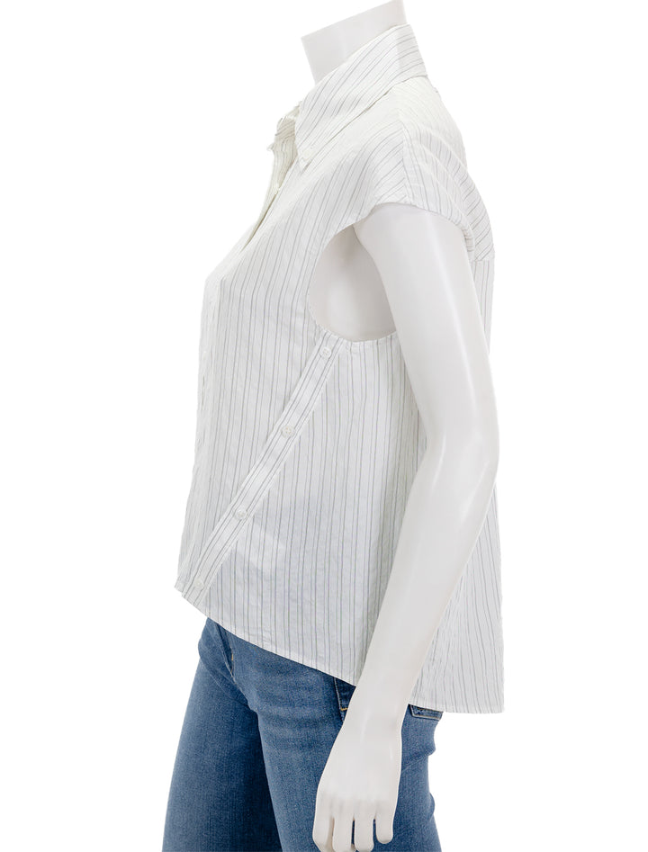 Side view of Saint Art's perth cap sleeve button blouse in off white pinstripe.