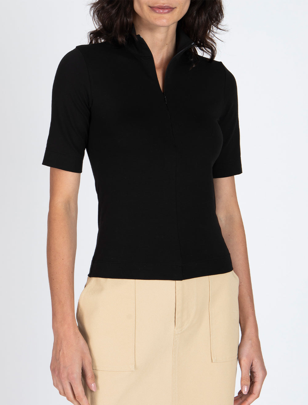 Model wearing ATM's pima cotton zip front top in black.
