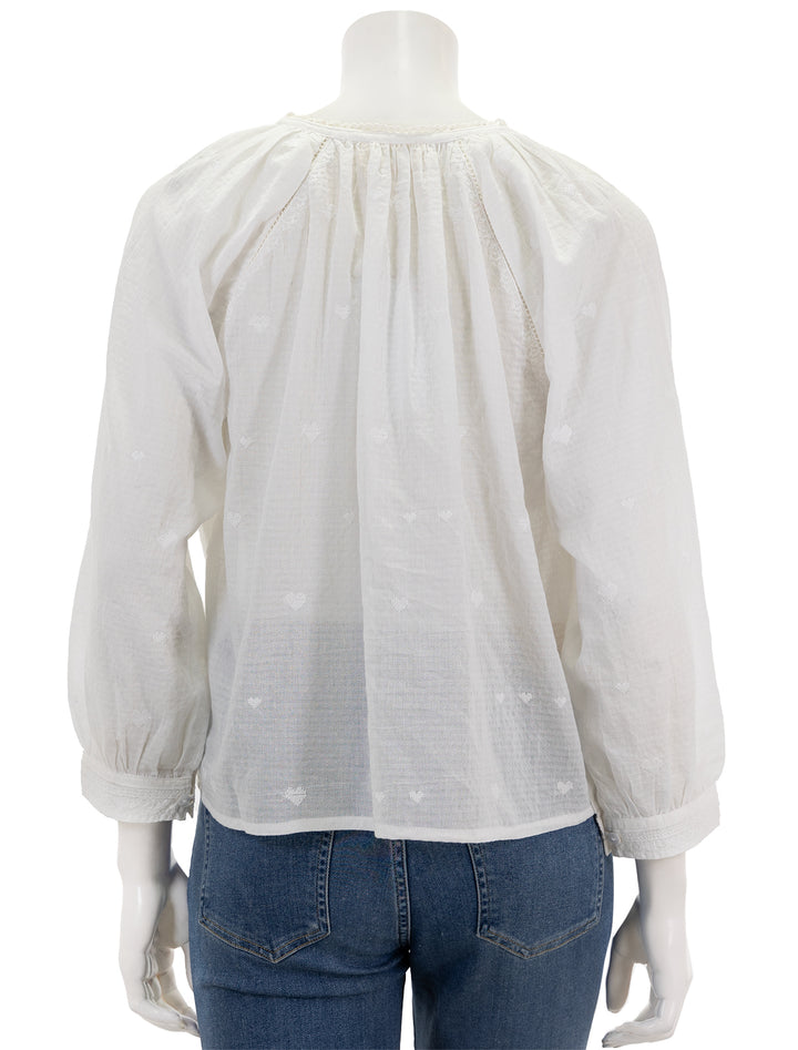 Back view of MABE's elani embroidered heart blouse in white.