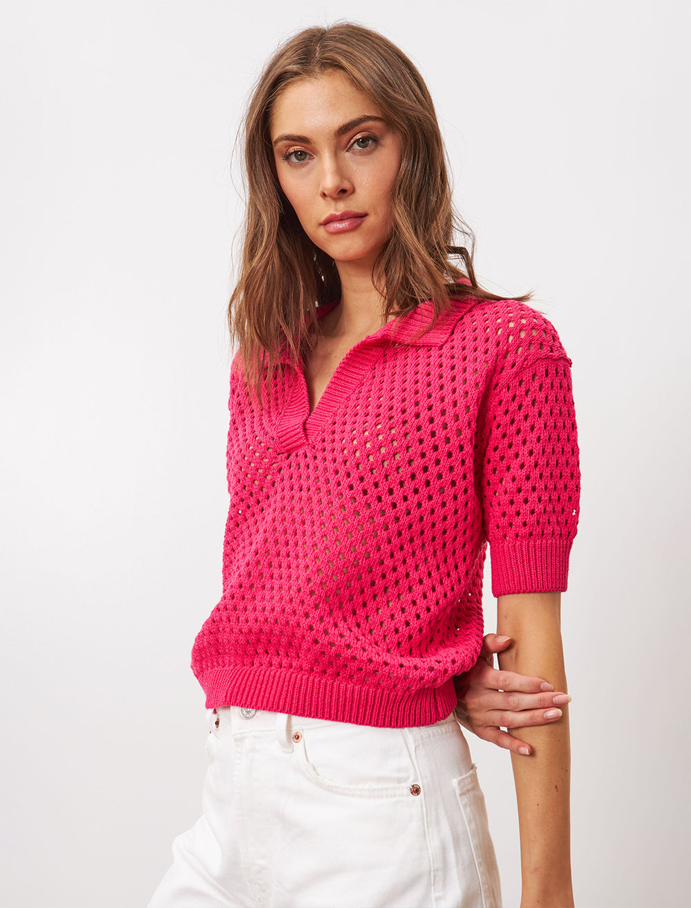 Model wearing Line the Label's Maggie Polo in Dragonfruit.