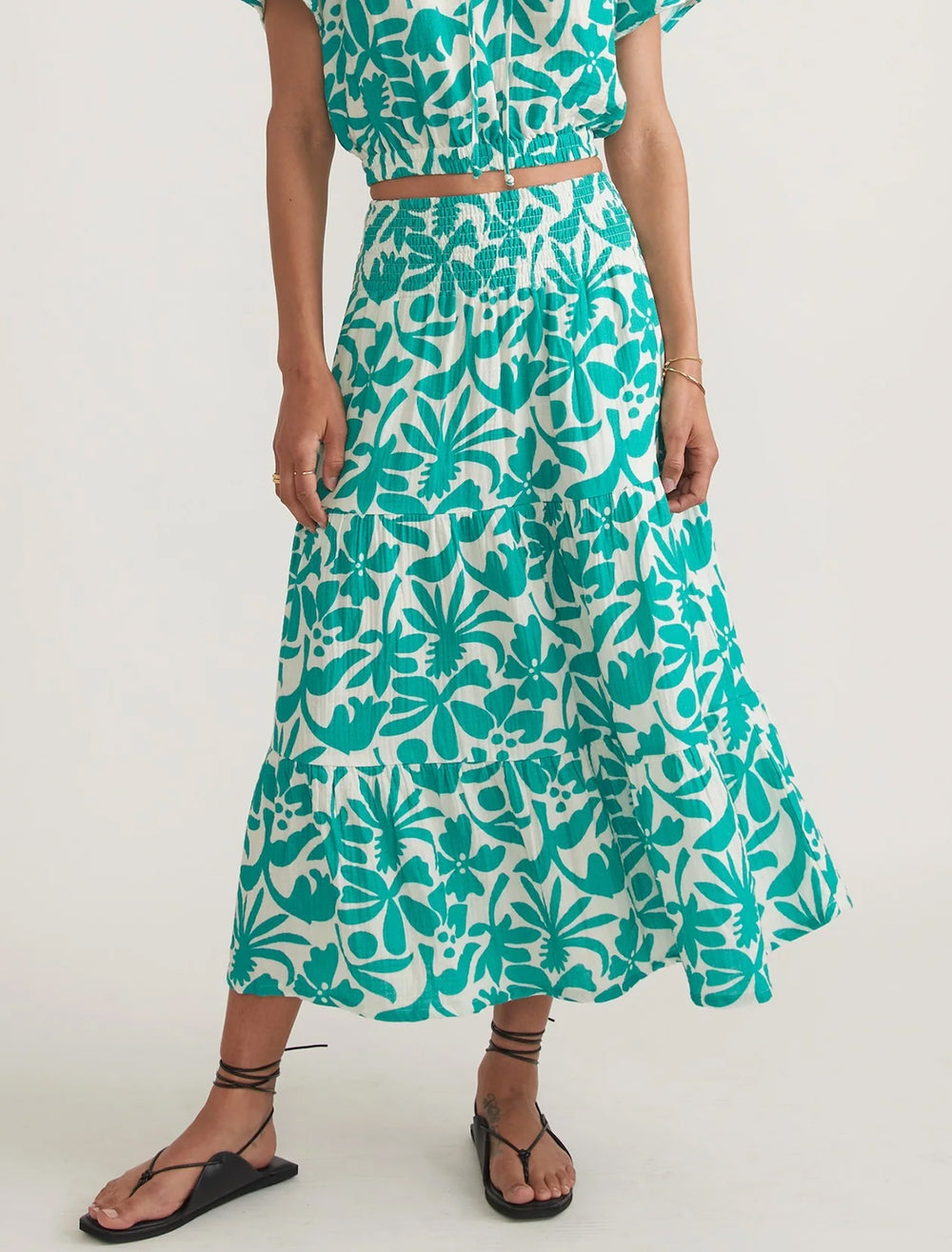 Model wearing Marine Layer's corinne double cloth maxi skirt in spruce flora.