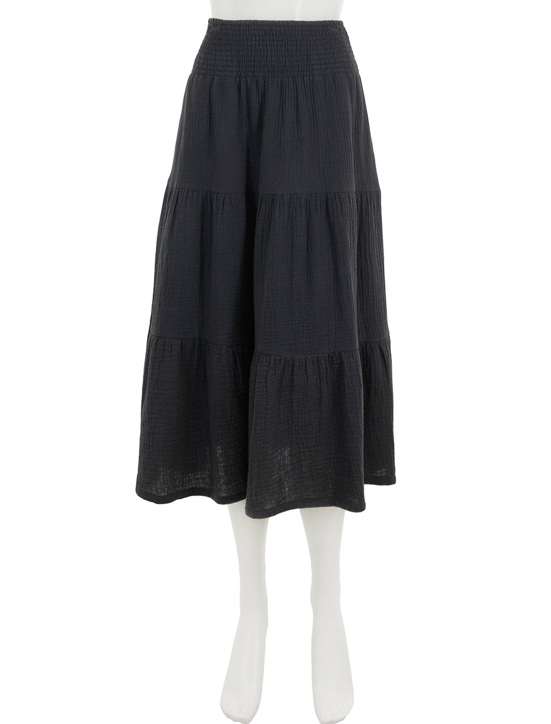 Front view of marine layer's corinne smocked waist maxi skirt in black.