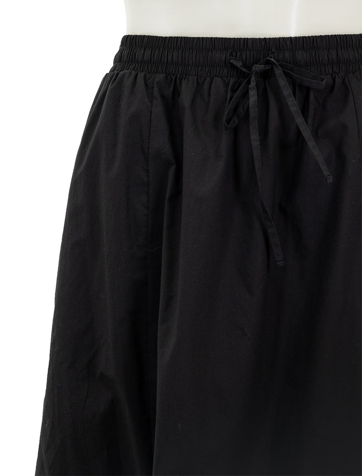 Close-up view of Steve Madden's sunny skirt in black.