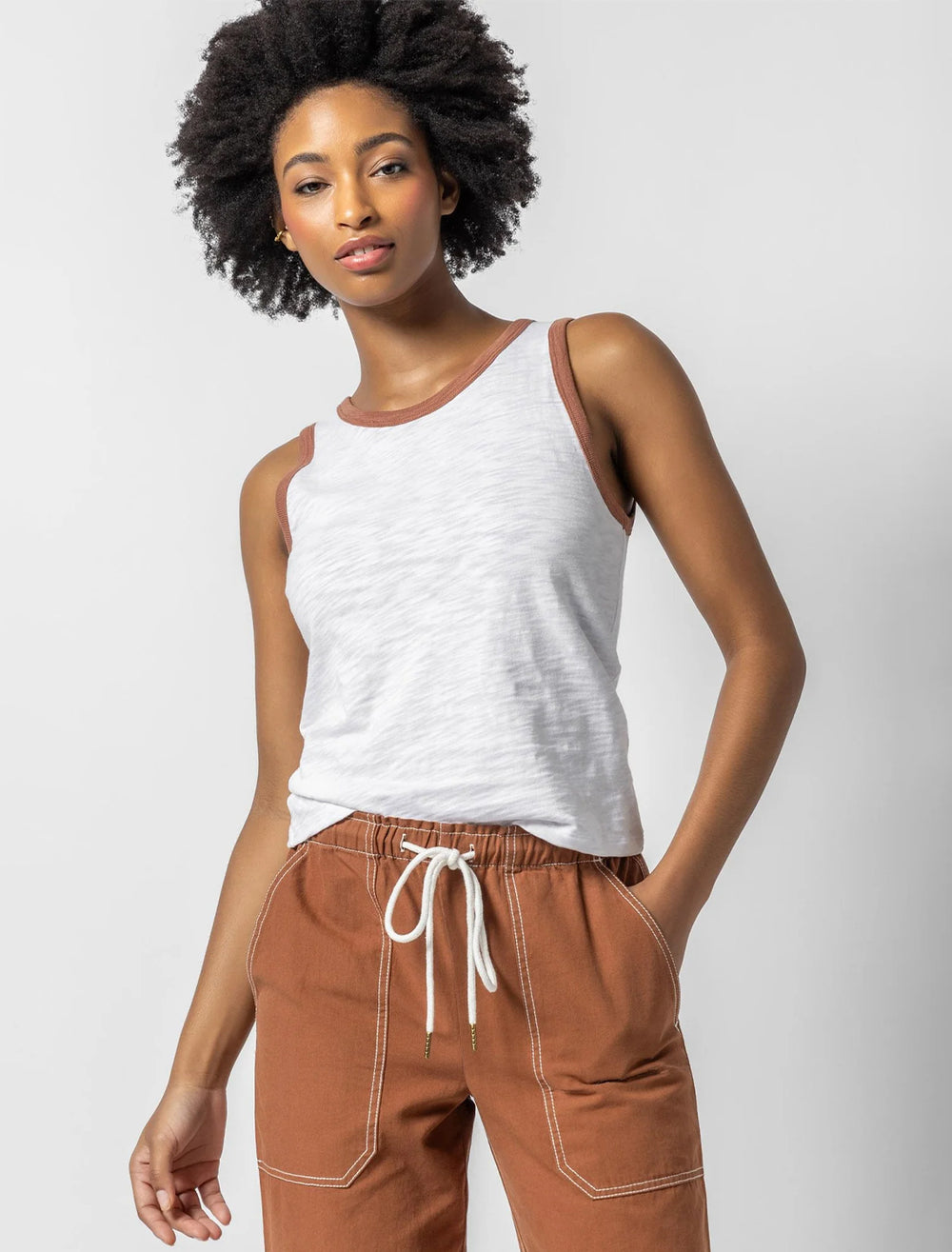 Model wearing Lilla P.'s colorblock tank in white and burnt sienna.