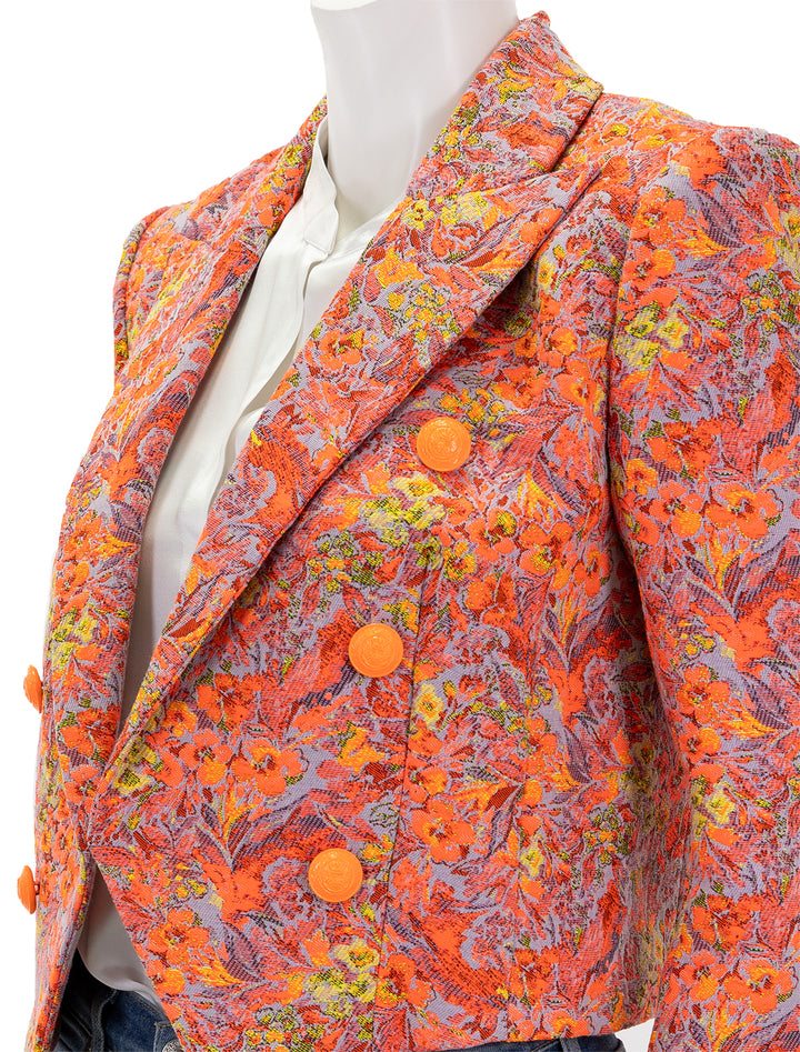 Close-up view of L'agence's lila boxy blazer in orange floral.