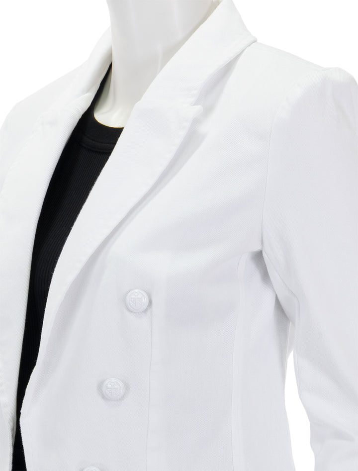 Close-up view of L'agence's wayne crop double breasted jacket in blanc.