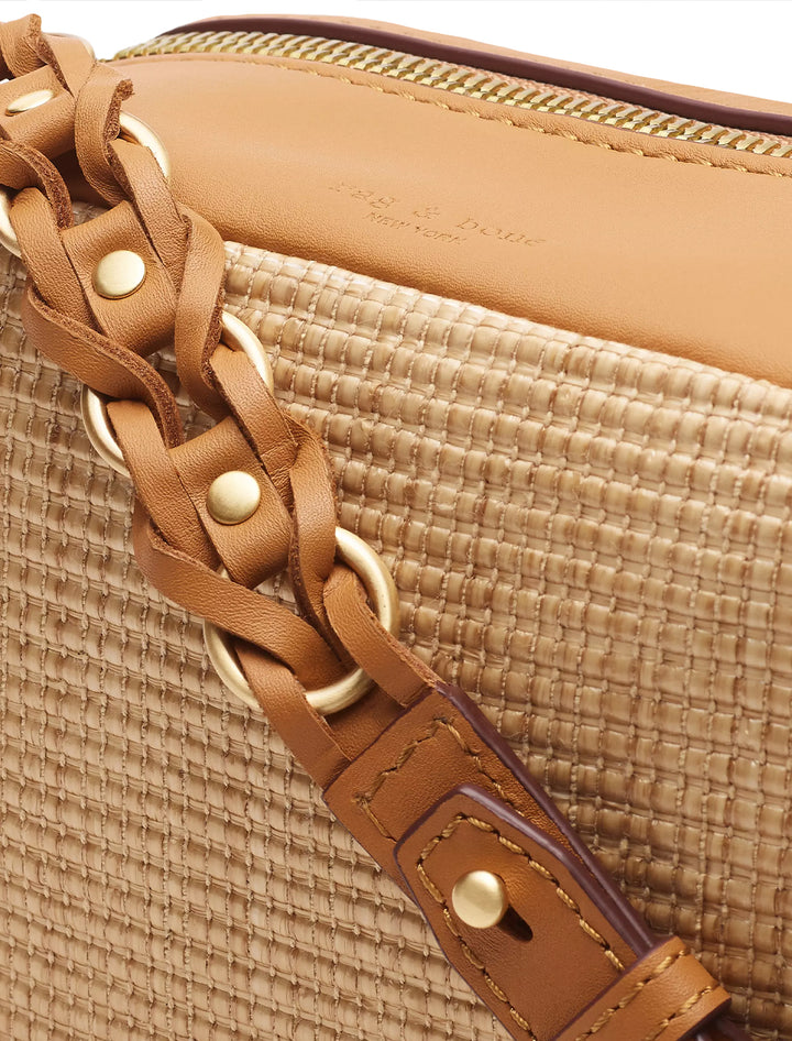 Close up view of Rag & Bone's cami straw cameral bag in natural alternative view.