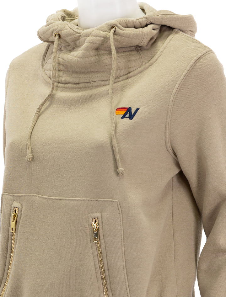 Close-up view of Aviator Nation's ninja pullover hoodie in sand.