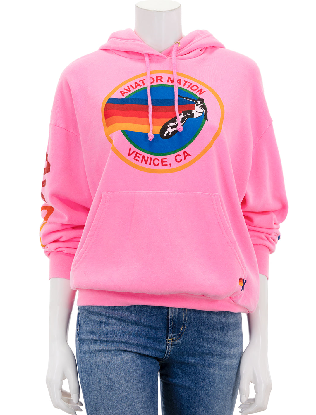 Front view of Aviator Nation's pullover hoodie relaxed in neon pink.