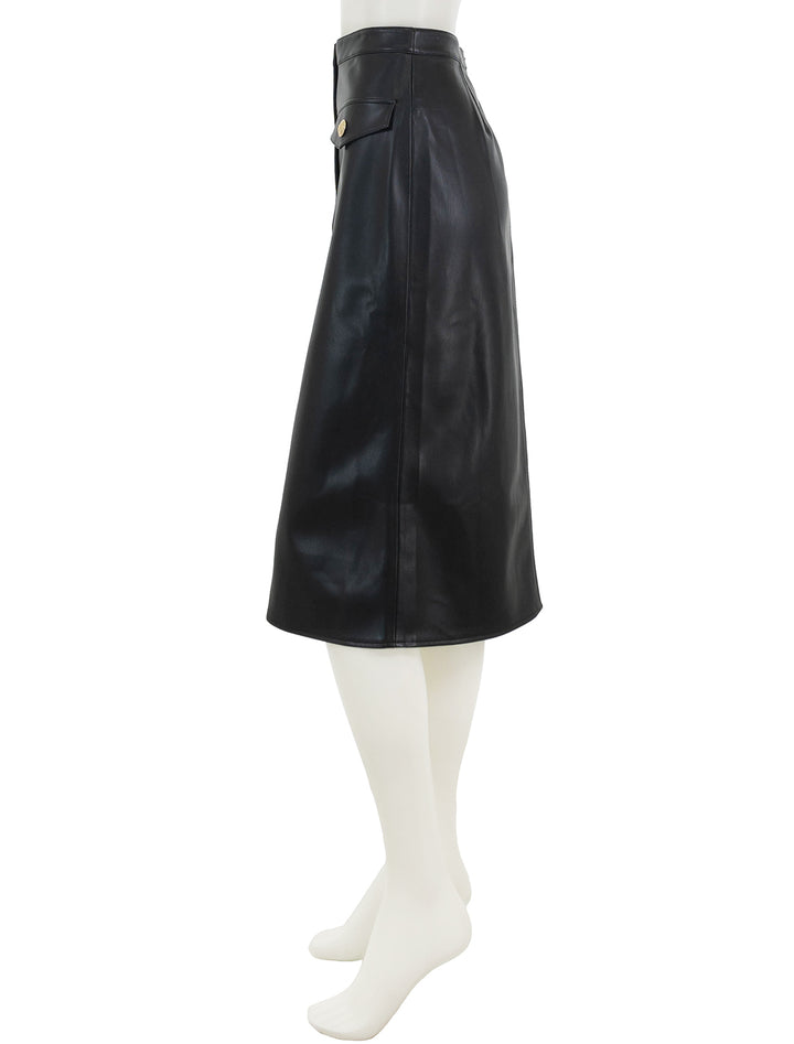 Side view of L'agence's milann midi skirt in black.