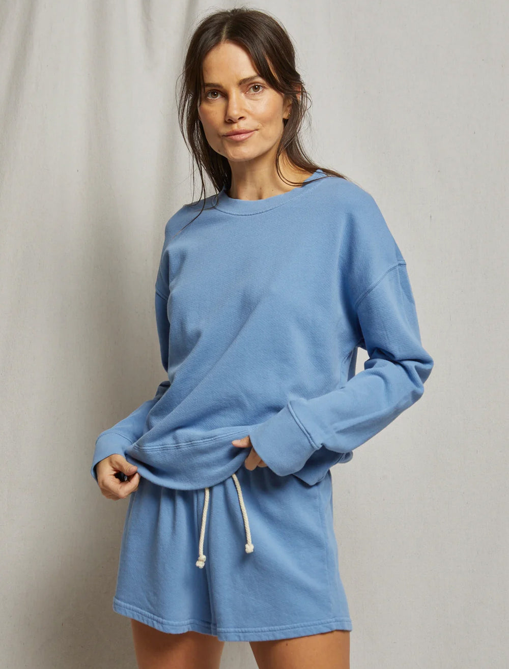 Model wearing Perfectwhitetee's tyler sweatshirt in caroline blue.