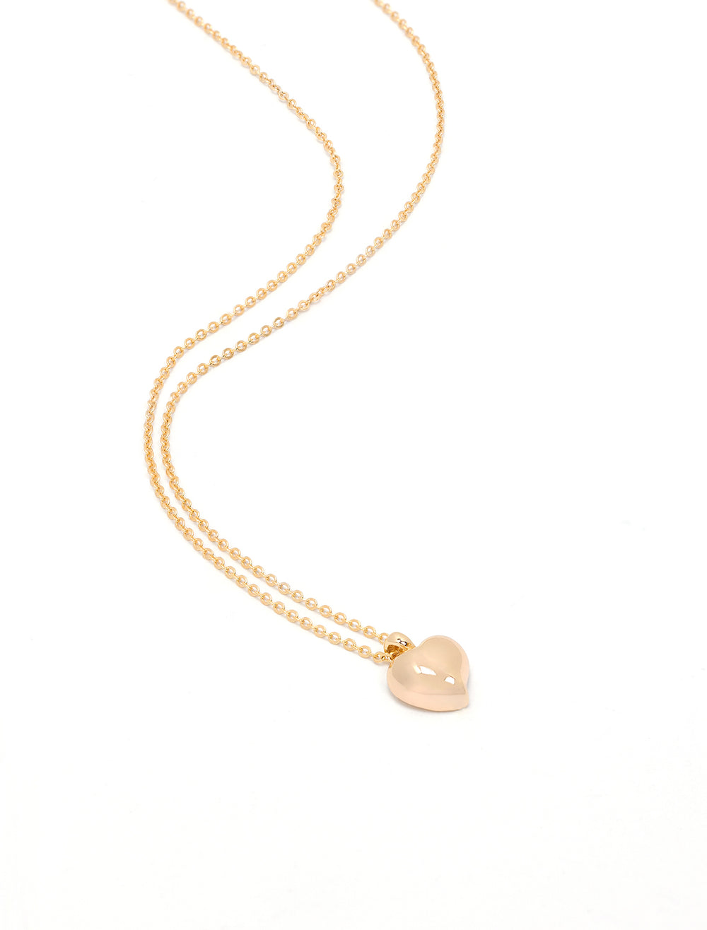Laydown view of Jonesy Wood's dove heart necklace.