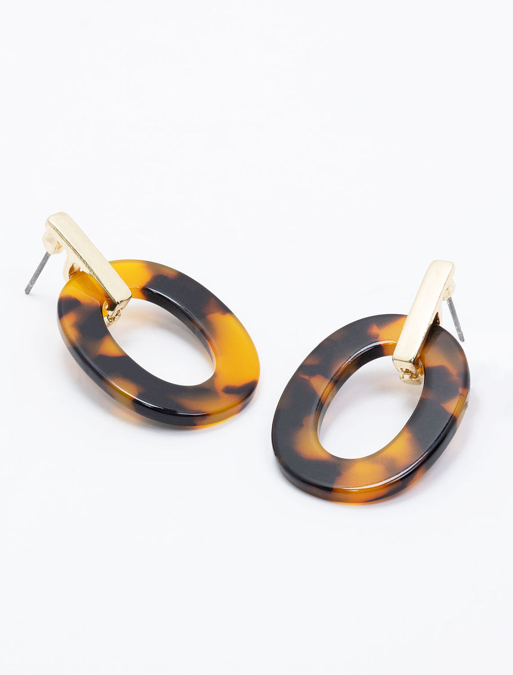 Laydown of West Eleventh's tortoise oval link hoops.