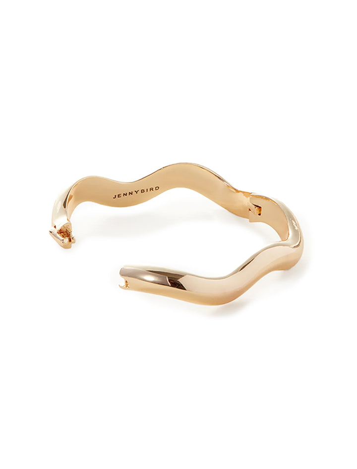 View of Jenny Bird's ola bangle in gold unclasped.