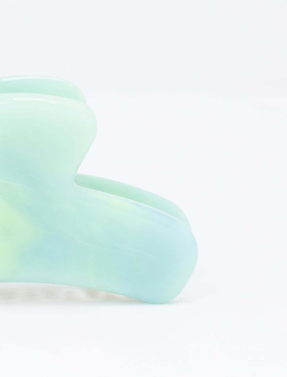 Close-up view of Fenna + Fei's mini french claw in jadeite.