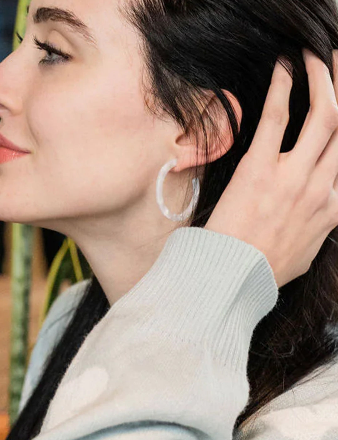 Model wearing S&S's camy hoops in pearl.