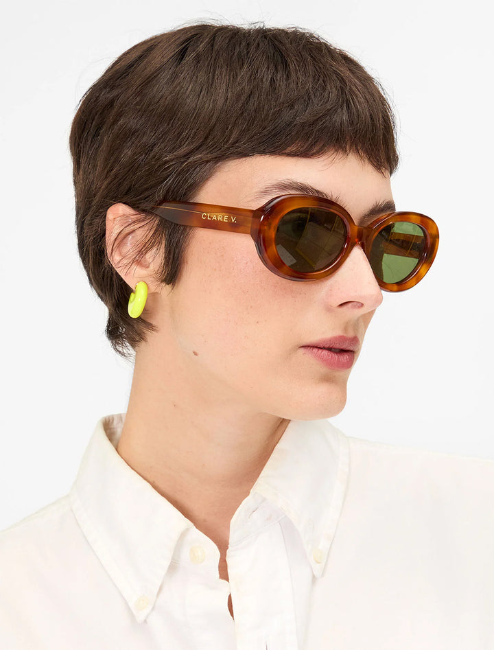 model wearing le hoop in neon yellow