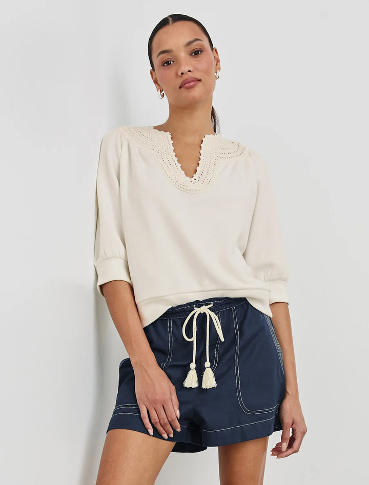 model wearing mariposa top in ivory