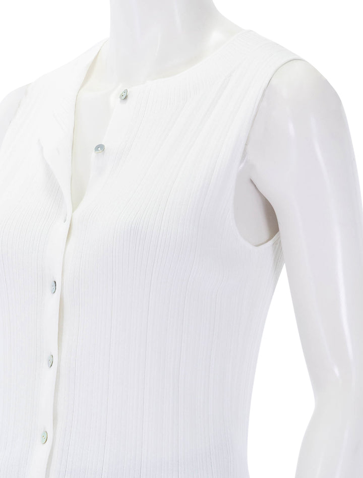 close up view of button up sweater shell in off white