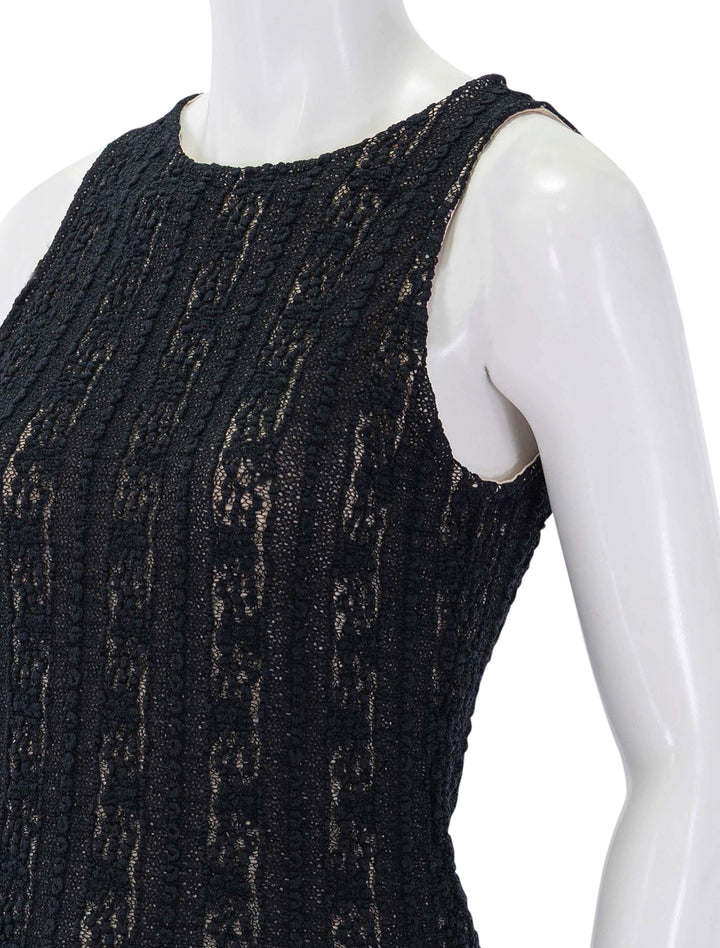 close up view of high neck shell in black textured lace