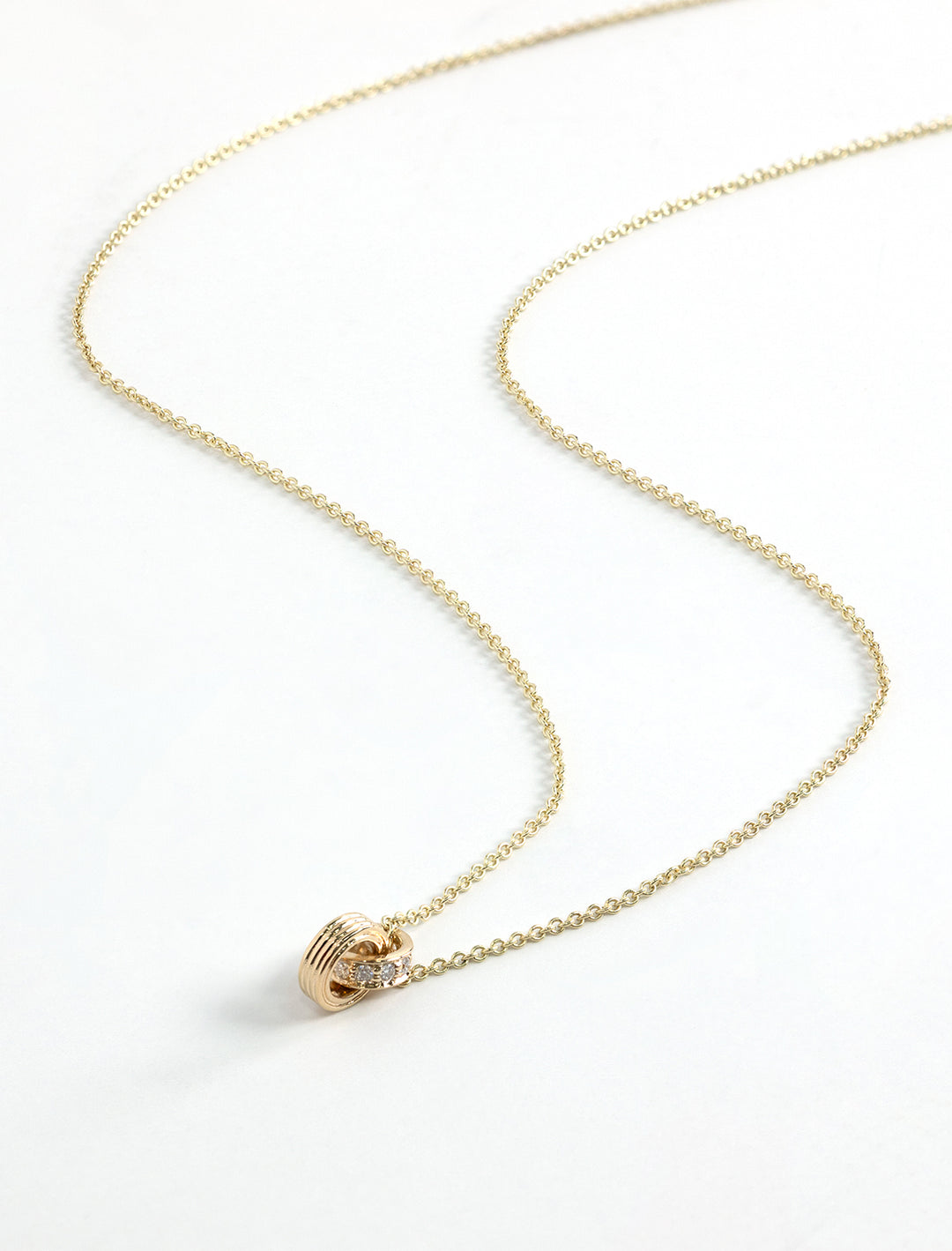 fluted linked o-ring charm necklace on 18" tiffany chain