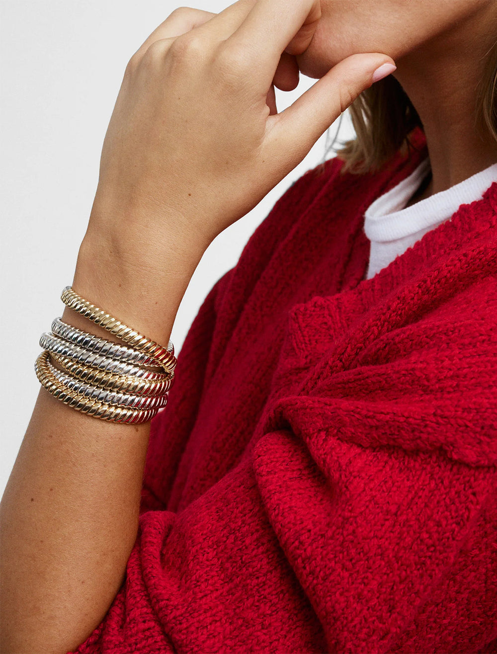 model wearing the double cobra bracelet in gold and silver