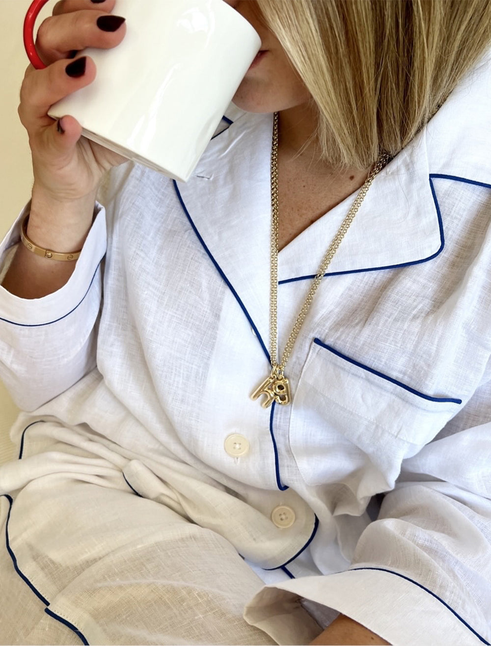 model wearing the puffy initial necklace | g