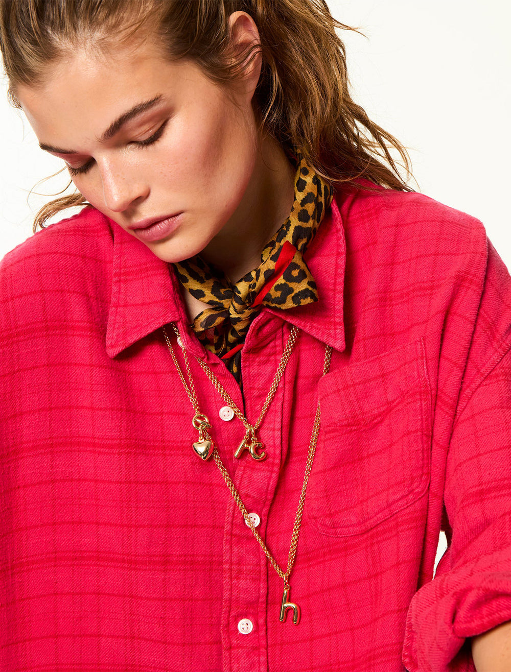 model wearing the puffy initial necklace | h
