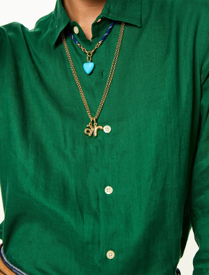model wearing the puffy initial necklace | r