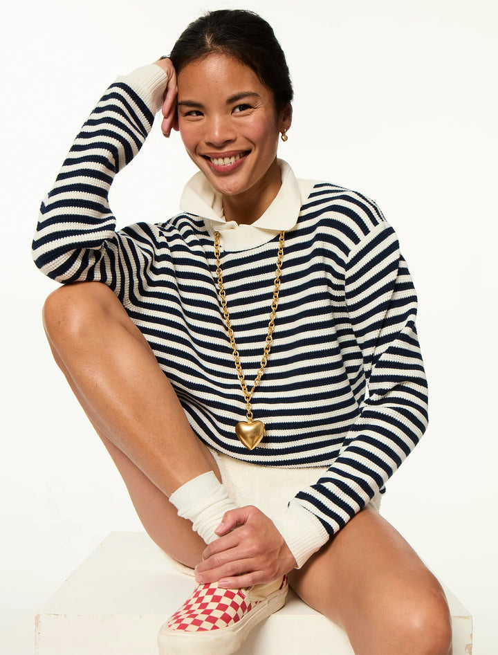 model wearing the puffy heart necklace in gold