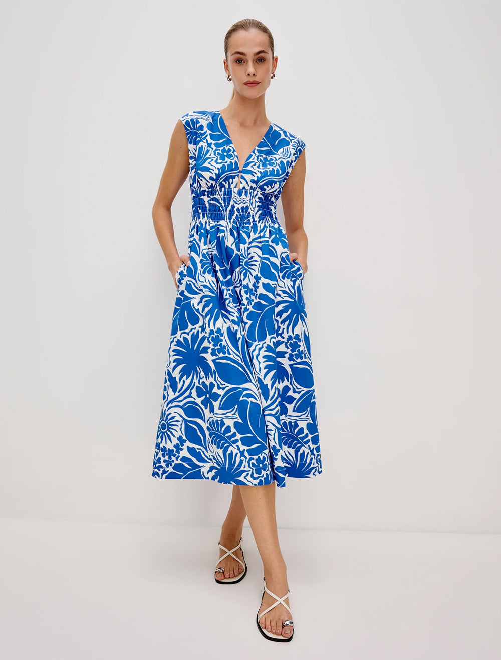 model wearing roxanne dress in blue riviera