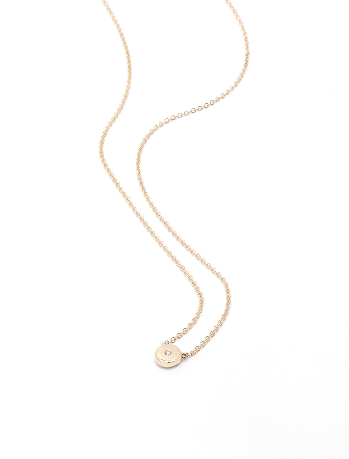 Laydown of diamond and gold small nugget necklace