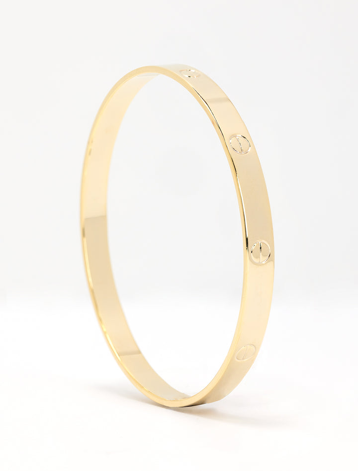 Close-up view of AV Max gold screw accent bangle