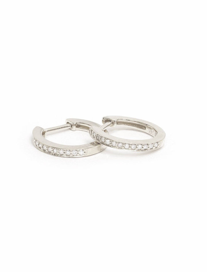 Sydney Evan's pave huggie hoops in white gold.