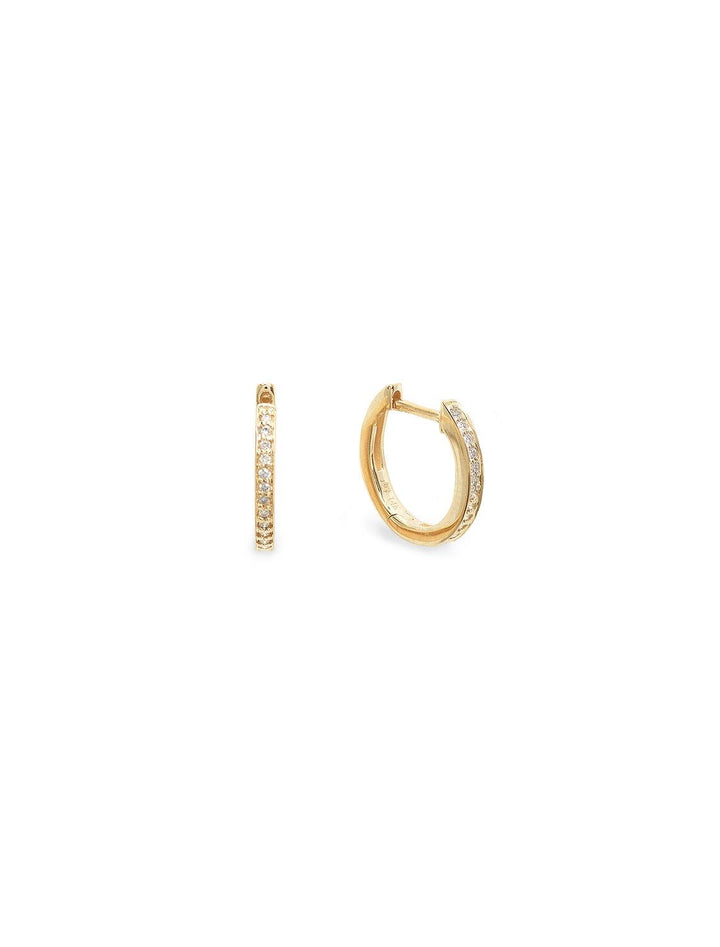 Sydney Evan's pave huggie hoops in yellow gold.